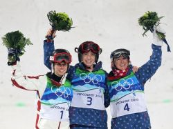 VANCOUVER, BC - FEBRUARY 13: (L-R) Jennifer Heil of Canada celebrates silver, Hannah Kearney of United States celebrates gold and Shannon Bahrke of United States celebrates bronze during the flower ceremony for the women's freestyle skiing moguls held at the Whistler Medals Plaza on day 2 of the Vancouver 2010 Winter Olympics at Cypress Mountain Resort on February 13, 2010 in Vancouver, Canada. (Photo by Jamie Squire/Getty Images)
